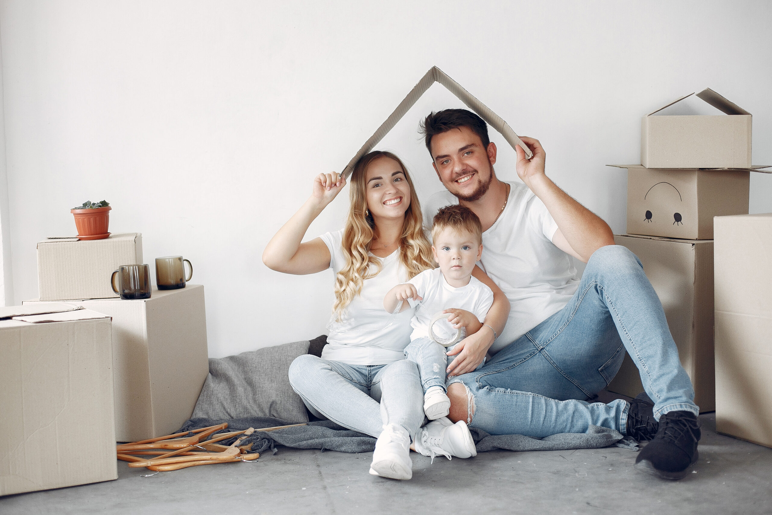 family moving using boxes scaled